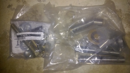 The bag on the left is hardware for the steering arms, the one on the right is kingpins and installation hardware.